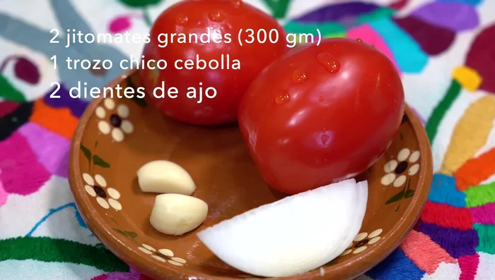 Make the sauce: Cook tomatoes, guajillo chiles, and guajillo pua chiles in water until the tomato skins burst. Blend cooked tomatoes, onion, garlic, spices, and cooking water.