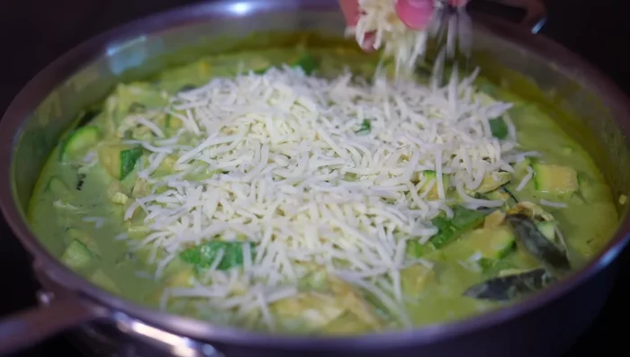 Add the cheese; turn off the heat and cover. Let it sit to melt the cheese and finish cooking the zucchini.