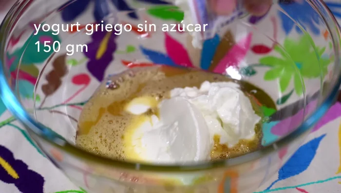 Add 150 grams (or ½ cup) of unsweetened Greek yogurt and some taco-style sour cream. Beat until well combined. (70.68)