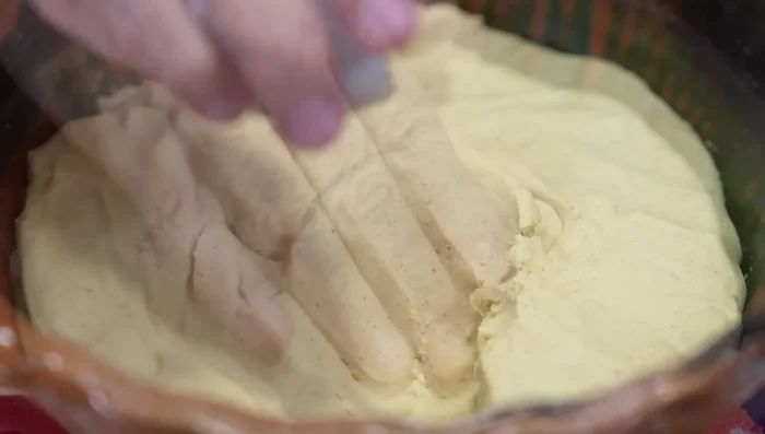 Prepare the dough for quesadillas: Add baking powder and wheat or rice flour (rice flour is preferred for crispy exterior and soft interior) to the rested dough. Knead until soft and pliable, but not watery.