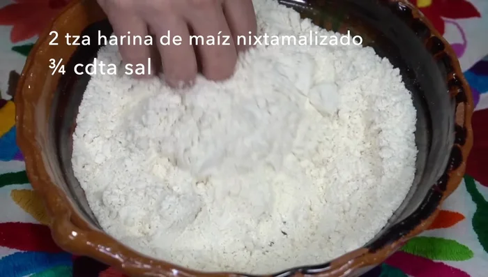 Prepare the corn dough: If using nixtamalized corn flour, mix with salt and gradually add warm water until a well-hydrated dough forms. Cover with plastic wrap and let it rest for at least an hour (preferably a couple of hours).