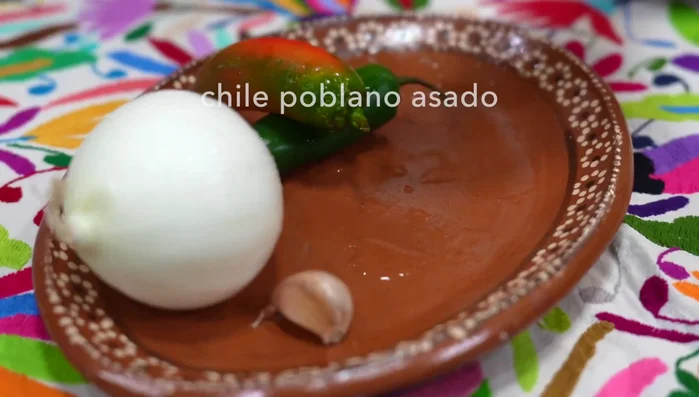 Roast, peel, seed, and thinly slice the poblano pepper. (119.7)