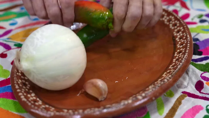 Slice jalapeños and onion thinly; finely chop the garlic. (131.34)