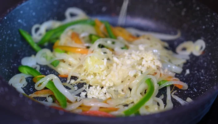 Add garlic, poblano strips, and cook for 2 minutes. (169.86)