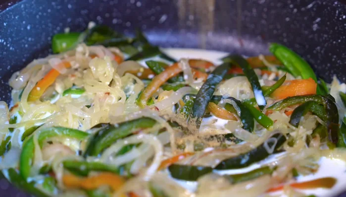 Add milk to lower the pan temperature, then add chicken bouillon, crema, and stir well. (180.239)