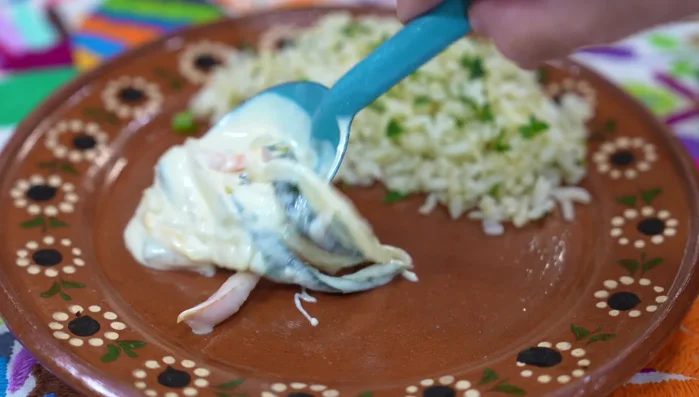 Serve fish over rice, topped with pepper cream sauce. (315.36)