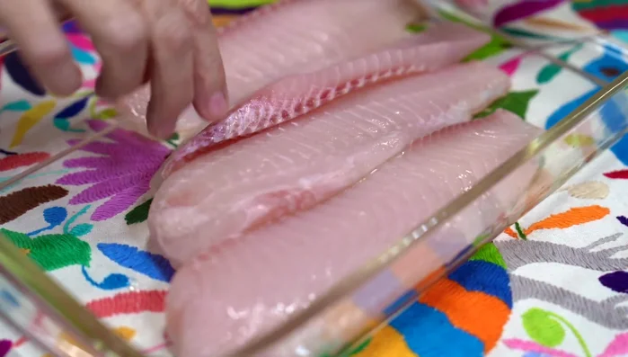Marinate tilapia with lemon juice, salt, pepper, and garlic powder for 20 minutes. (59.76)
