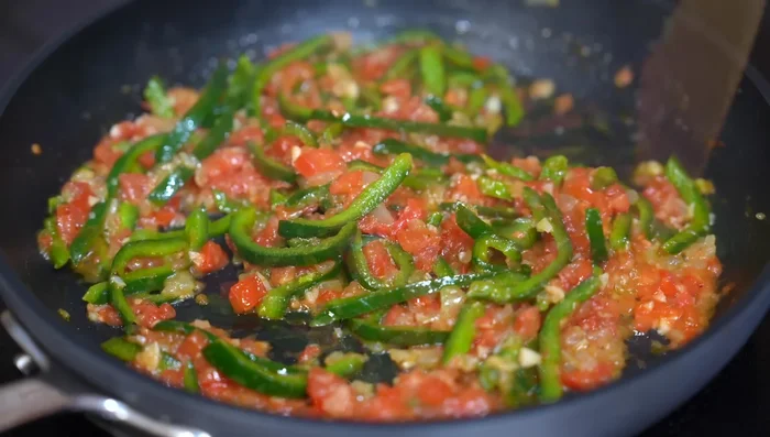 Add chipotle mayonnaise to the tomato mixture.