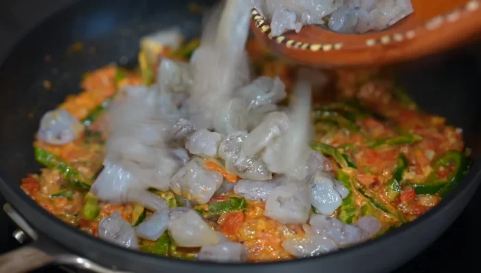 Add shrimp and cook until pink (about 2.5 minutes). Remove from heat immediately.