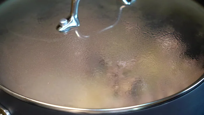 Lower heat, cover, and cook for 7-8 minutes, adding a little water if needed to maintain moisture.