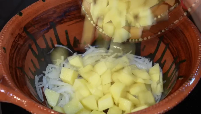 Add the potatoes to the pot with the onion, season with salt and cook for 5 minutes.