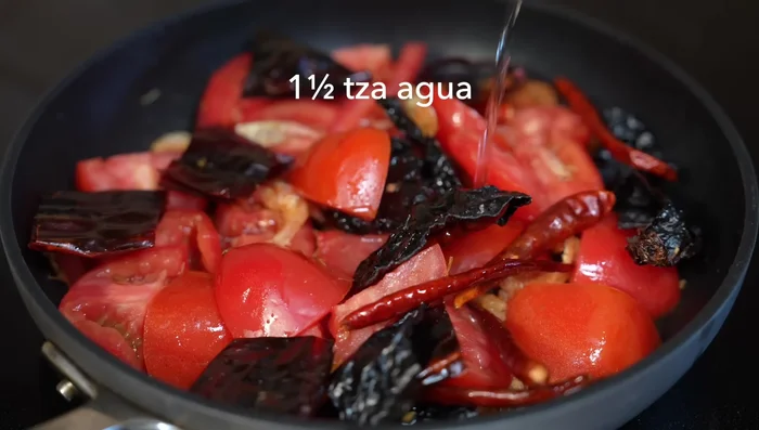Add water, cover, and simmer for 10 minutes until chilies and tomatoes are soft.