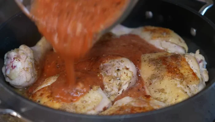 Pour the roasted sauce into the pan, stir well, bring to a boil, reduce heat to low, cover, and simmer for 20 minutes.