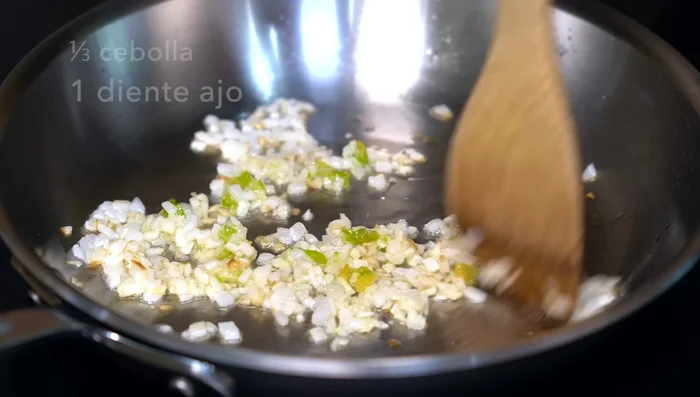 Prepare refried beans: Sauté onion, garlic and chili. Add beans, bring to a boil, then mash.