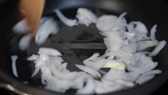 Sauté onions until almost cooked (5 minutes). Add shredded chicken and fry together.