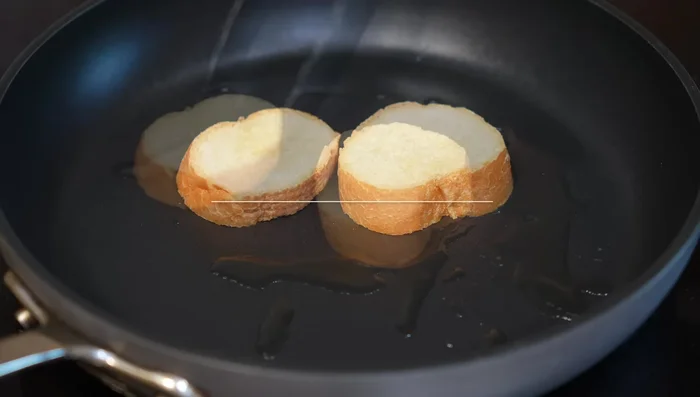 Fry bread slices until golden brown.