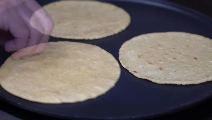 Serve the ribs with warm corn tortillas, white rice with rajas, and loquito.