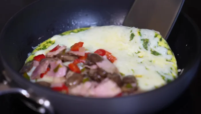 Fold the omelet in half like a quesadilla.
