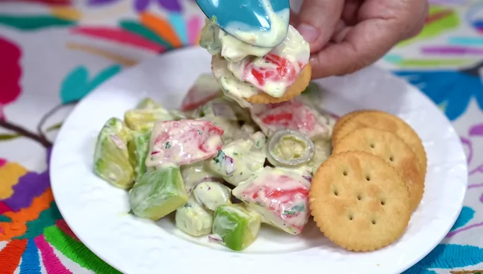 Serve the salad with crackers.