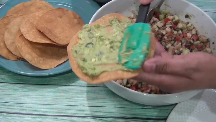 Assemble the tostadas: Layer the ceviche, avocado, and your favorite salsa on the tortillas. (863.87)