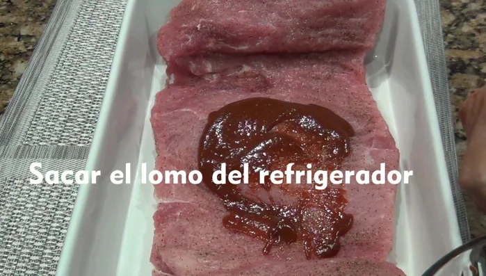 Coat the pork loin generously with the sauce.