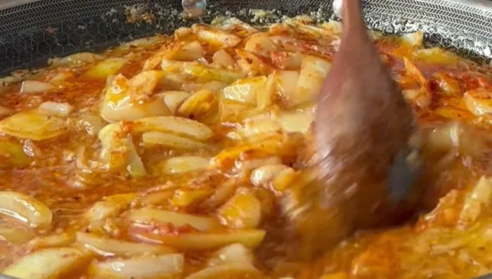 Simmer, allowing the onions to cook down. Add monk fruit sugar (or brown sugar) to balance the flavors.