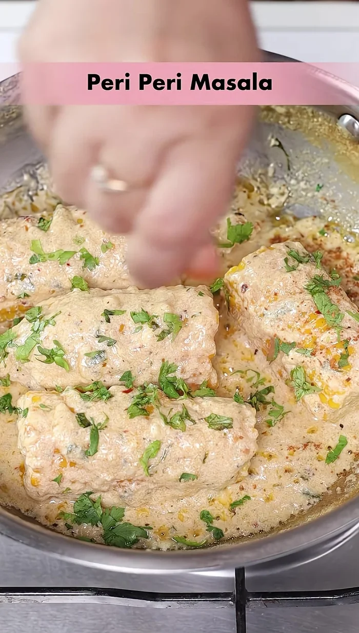 Garnish with fresh coriander and peri-peri masala.
