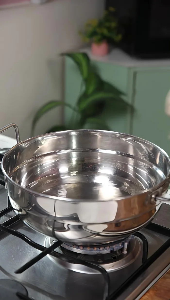 Steam the corn in boiling water (or pressure cooker) for 15 minutes after brushing with butter.