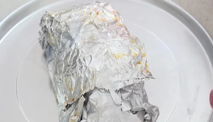 Remove the pork shanks from the steamer and coat them with the thickened marinade.