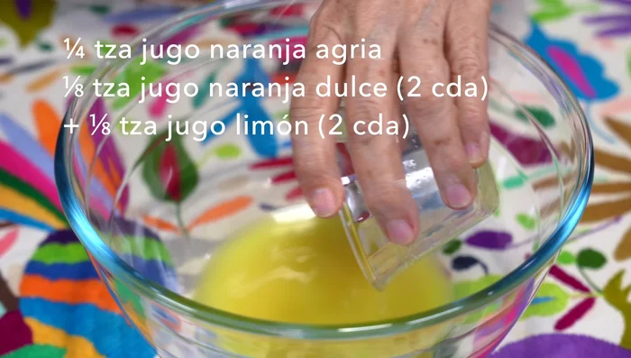 In a container, combine the ground spices with sweet orange juice, lemon juice, beer, soy sauce, onion powder, paprika, and olive oil.