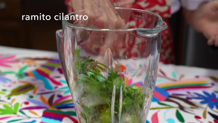 Blend the cooked jalapeños, garlic, onion, cooking water, cilantro, and lemon juice until smooth.