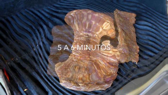Grill the arrachera for 5-6 minutes per side, then let it rest for 5 minutes before slicing against the grain.