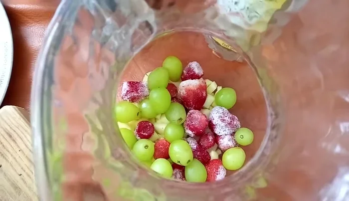 Add the grapes to the pitcher.