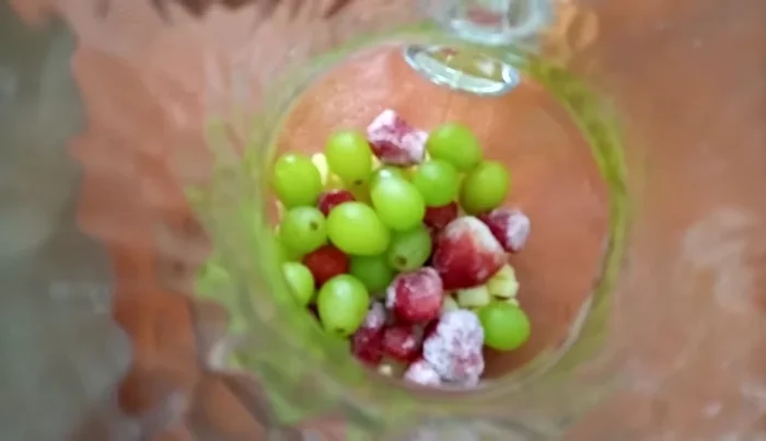 Add the red wine to the pitcher.