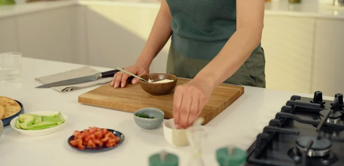Mix sour cream with a bit of water and season with salt and pepper.