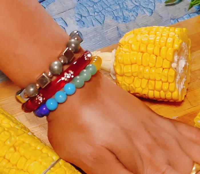 Prepare Mexican Elote: Cut the corn kernels off the cob. Boil the kernels until tender, adding salt for flavor.