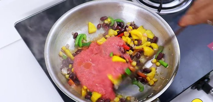 Add tomato puree, onion puree, chili flakes, oregano, black pepper, salt and Kashmiri red chili powder. Sauté for 3-4 minutes until oil separates.