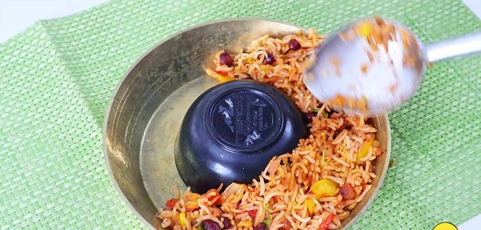 To serve: Place a small ball of rice in the center of a dish. Spread the remaining rice around it. Invert the dish to create a neat presentation.