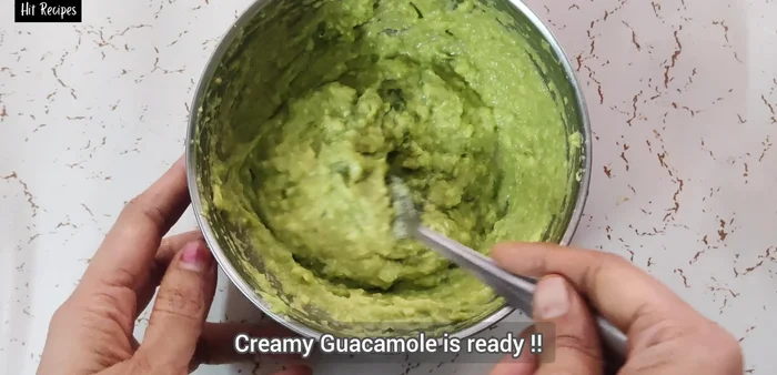 Mix all ingredients well to create a creamy guacamole.