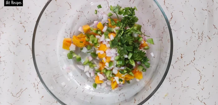 Add one or two tablespoons of finely chopped fresh coriander leaves. Mix well. Add red chili flakes for extra spice, if desired, but balance with green chili.