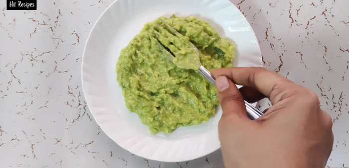 Layer the avocado dip on a serving plate, then top with the mango salsa.