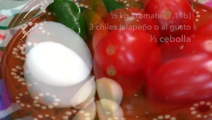 Prepare the sauce: Roast tomatoes, garlic cloves, onion, and chilies on a hot griddle.