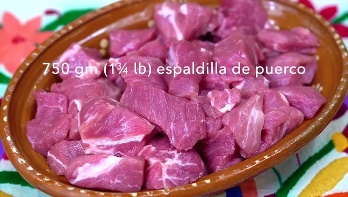 Cut pork shoulder into small pieces. Season with salt and let it rest for at least half an hour.