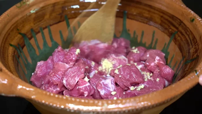 Add chopped garlic and stir well. Cover and cook, occasionally stirring to prevent sticking.