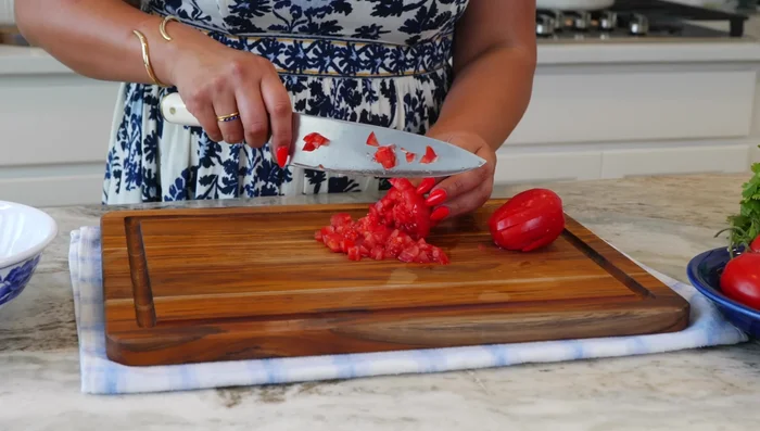 Prepare pico de gallo: Dice tomatoes, onions, and cilantro. Add salt and lime or lemon juice to taste.
