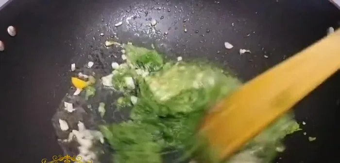 Add the herb paste (garlic, ginger, chilies, basil, coriander) and sauté well.