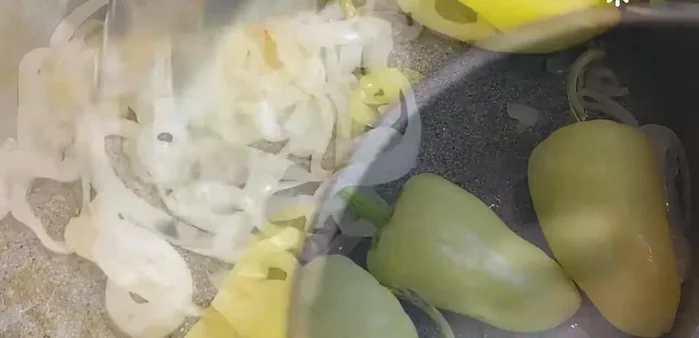 Add the Caribbean peppers to the same pan and cook until soft, golden, and flavorful.