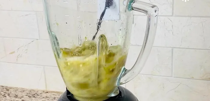 Blend the jalapeño peppers and their vinegar to create a flavorful sauce.