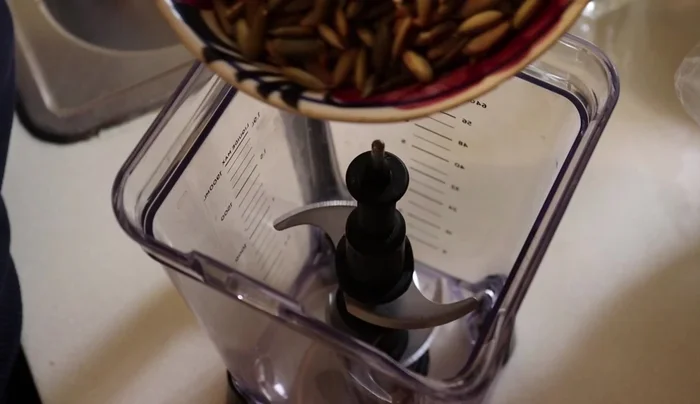 Grind the toasted pepitas and peanuts separately into a powder using a blender or mortar and pestle.