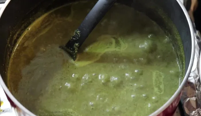Add the cooked pork backbones to the mole and simmer for another 10 minutes.